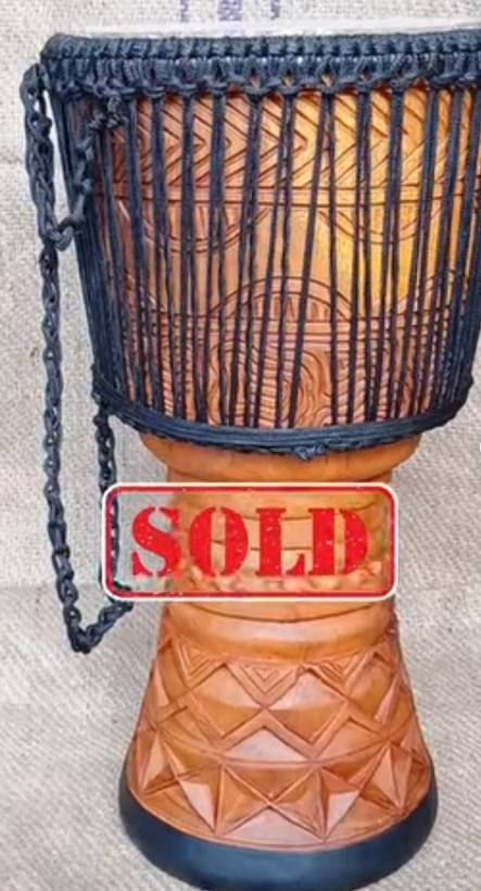 Carved djembe with rope tuning, marked sold
